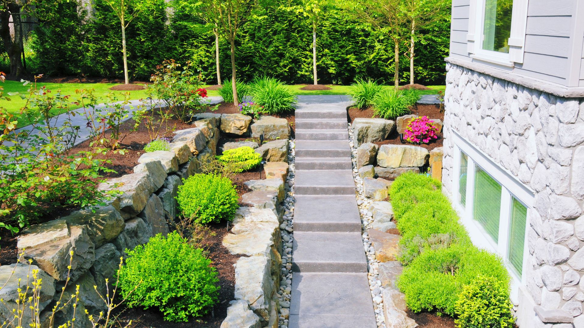 A stone path leading to a house in the woods